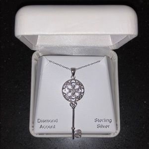 Sterling silver key pendant with chain. NWT.
